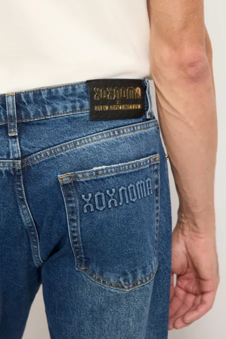 Джинсы с эффектом потертости